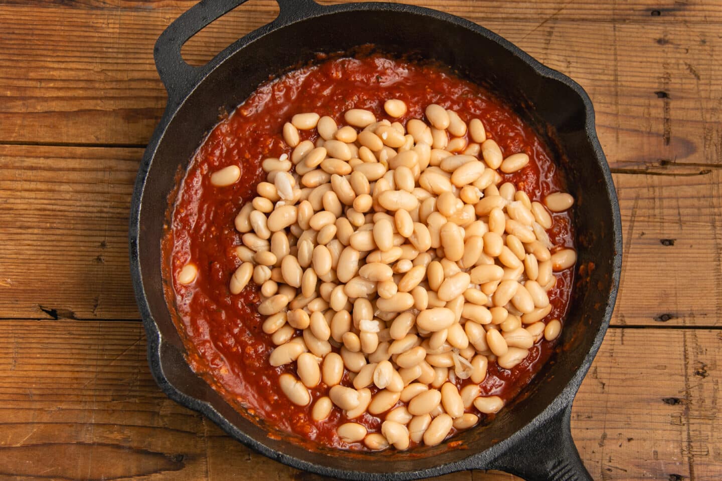 This is a picture of the skillet with white beans added.