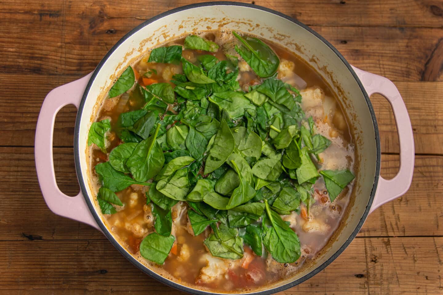 This is a picture of the large pot with spinach added.