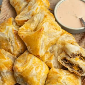 This is a square picture of the cheeseburger puff pastry bites.