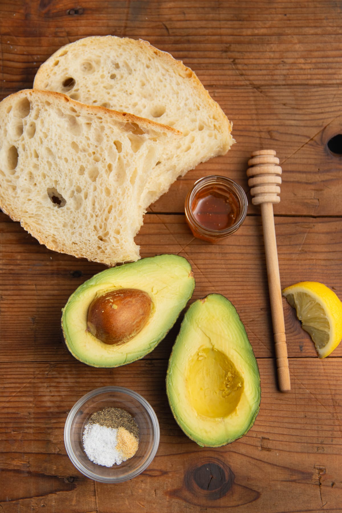This is a picture of the ingredients used to make avocado toast with honey.