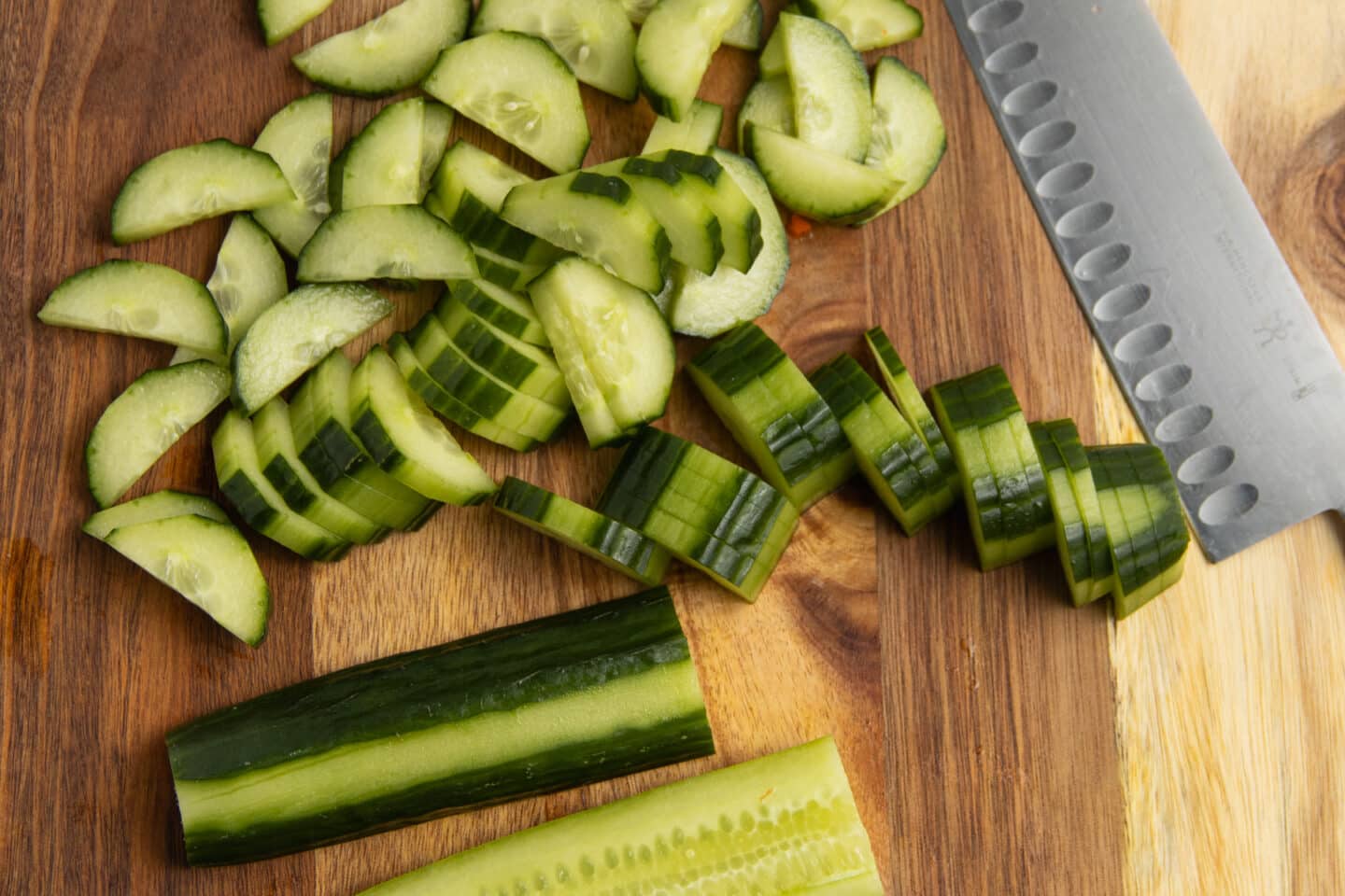 This is a picture of cucumber being sliced.