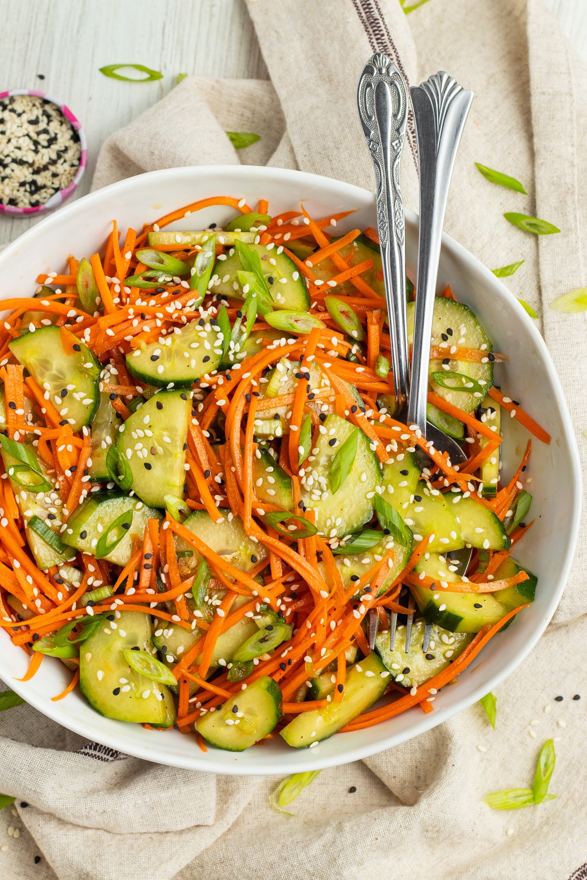 This is picture of cucumber and carrot salad in a bowl.