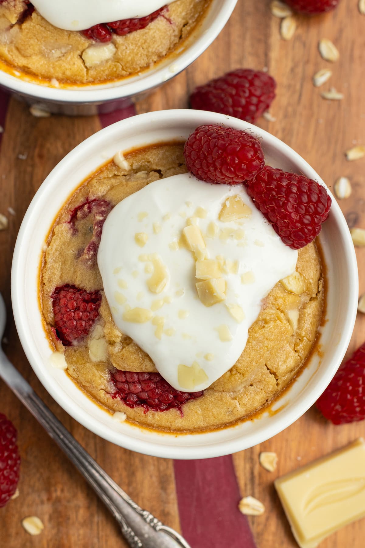 This is a picture of the white chocolate raspberry baked oats ready to eat with yogurt on top.