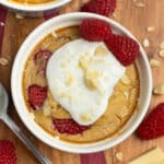 This is a picture of the white chocolate raspberry baked oats ready to eat with yogurt on top.