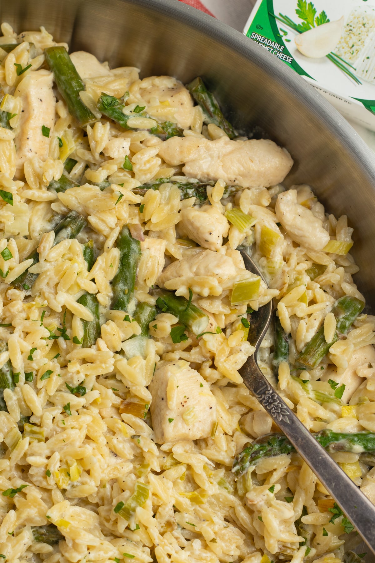 This is a picture of the chicken boursin orzo in a skillet.