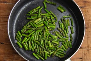 This is a picture of the skillet with asparagus cooking.
