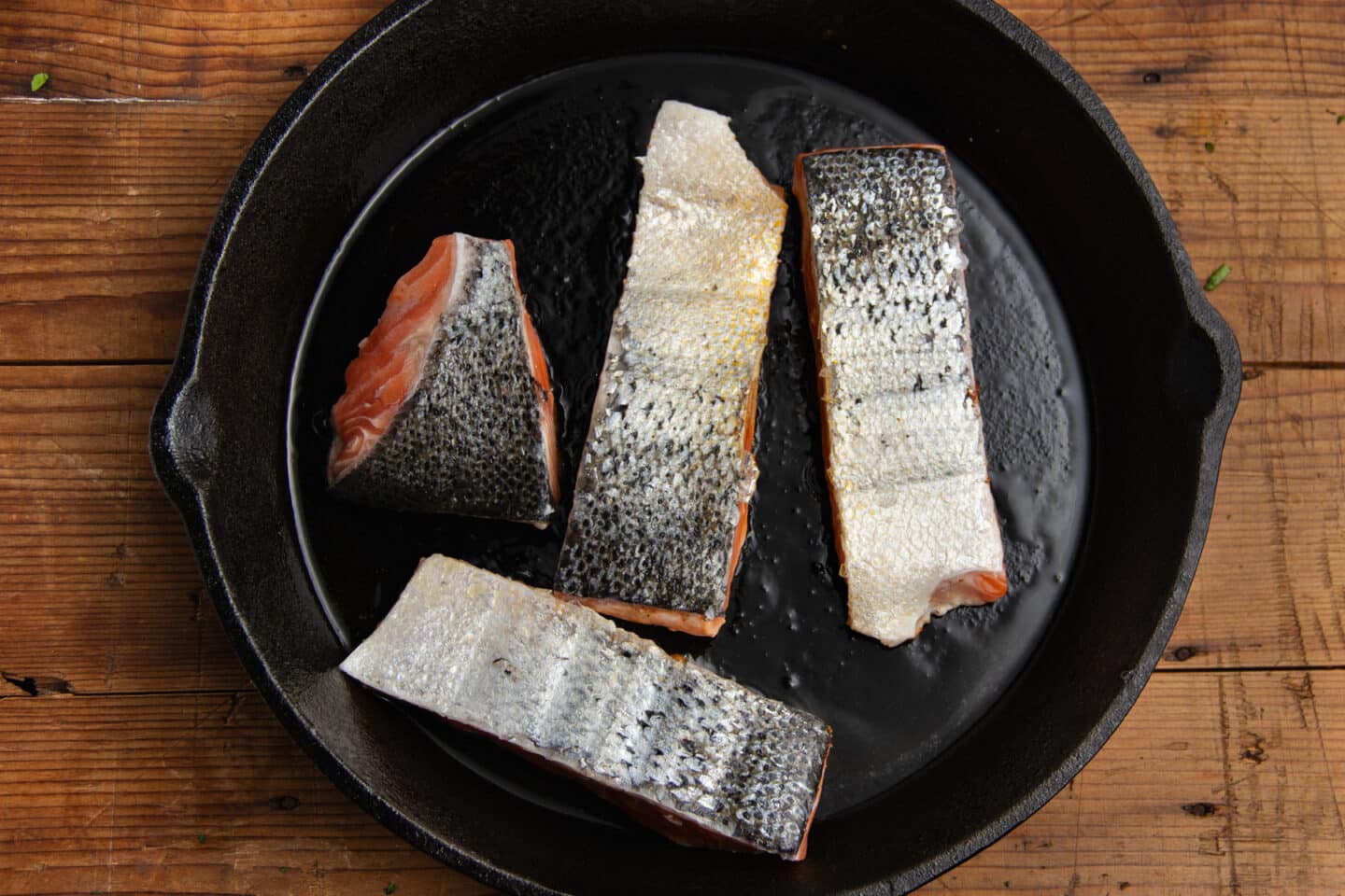 This is a picture of salmon filets being seared.