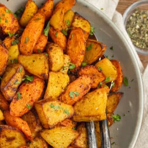 This is a picture of a plate with air fryer carrots and potatoes.