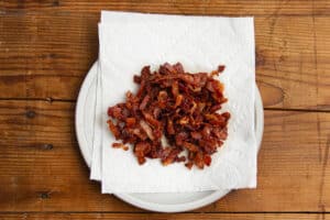 This is a picture of the chopped bacon resting on a paper towel.
