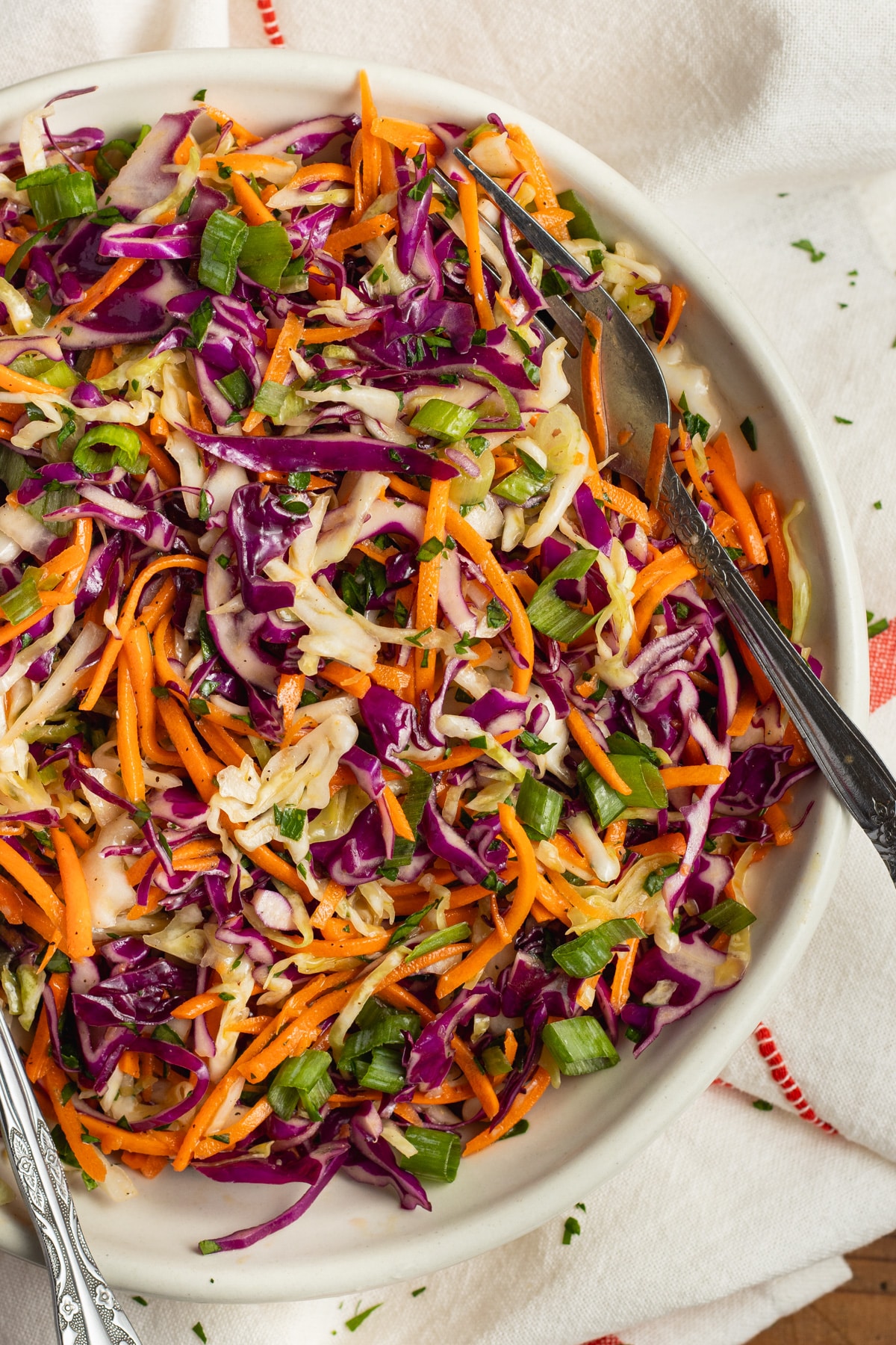 This is a picture of a bowl of cabbage carrot salad.