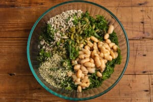 This is a picture of the salad being put together with the all the ingredients.