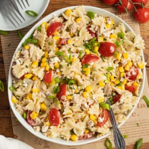 This is a square photo of a bowl of tuna corn pasta salad.