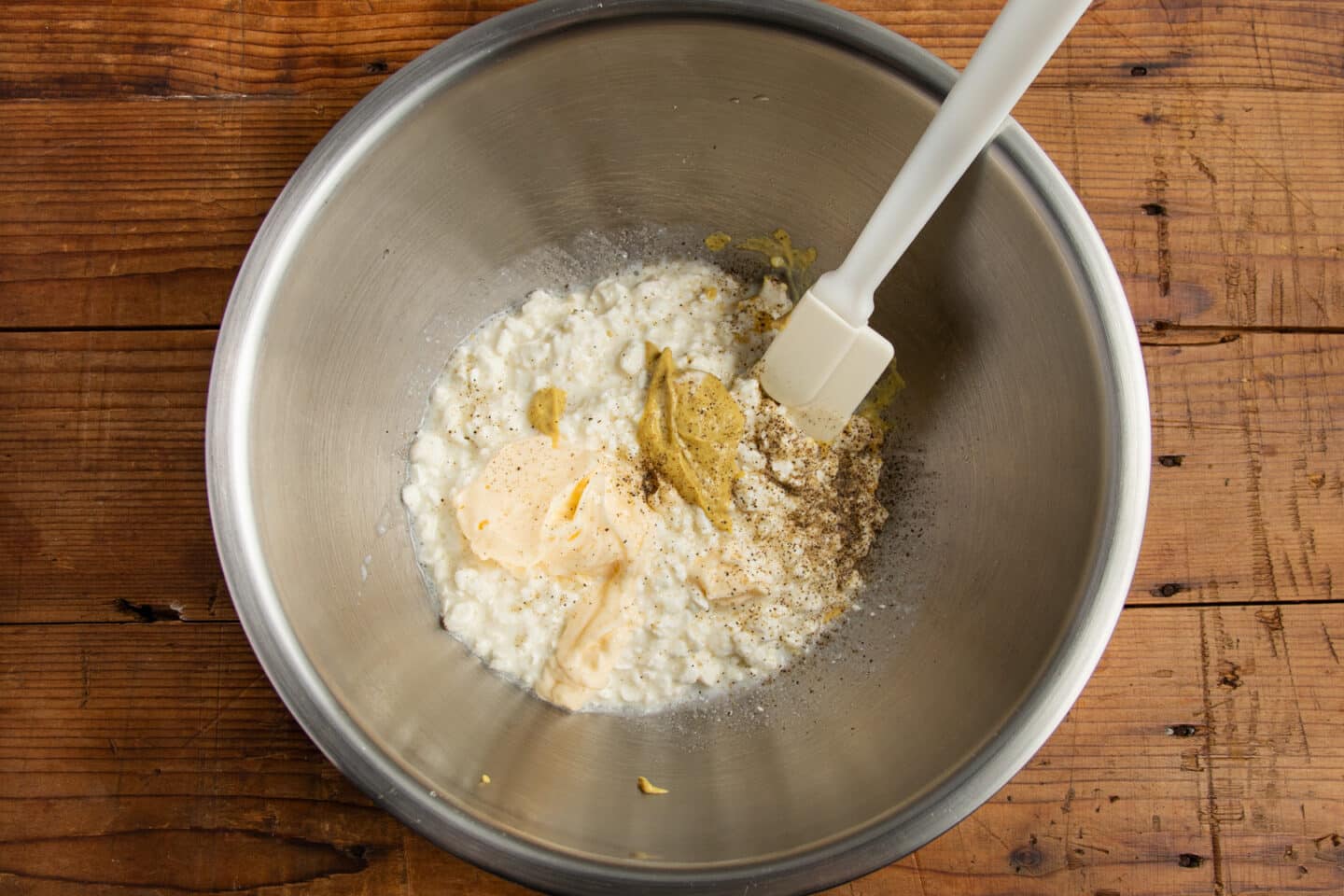 This is a picture of the ingredients for the dressing in a large bowl.