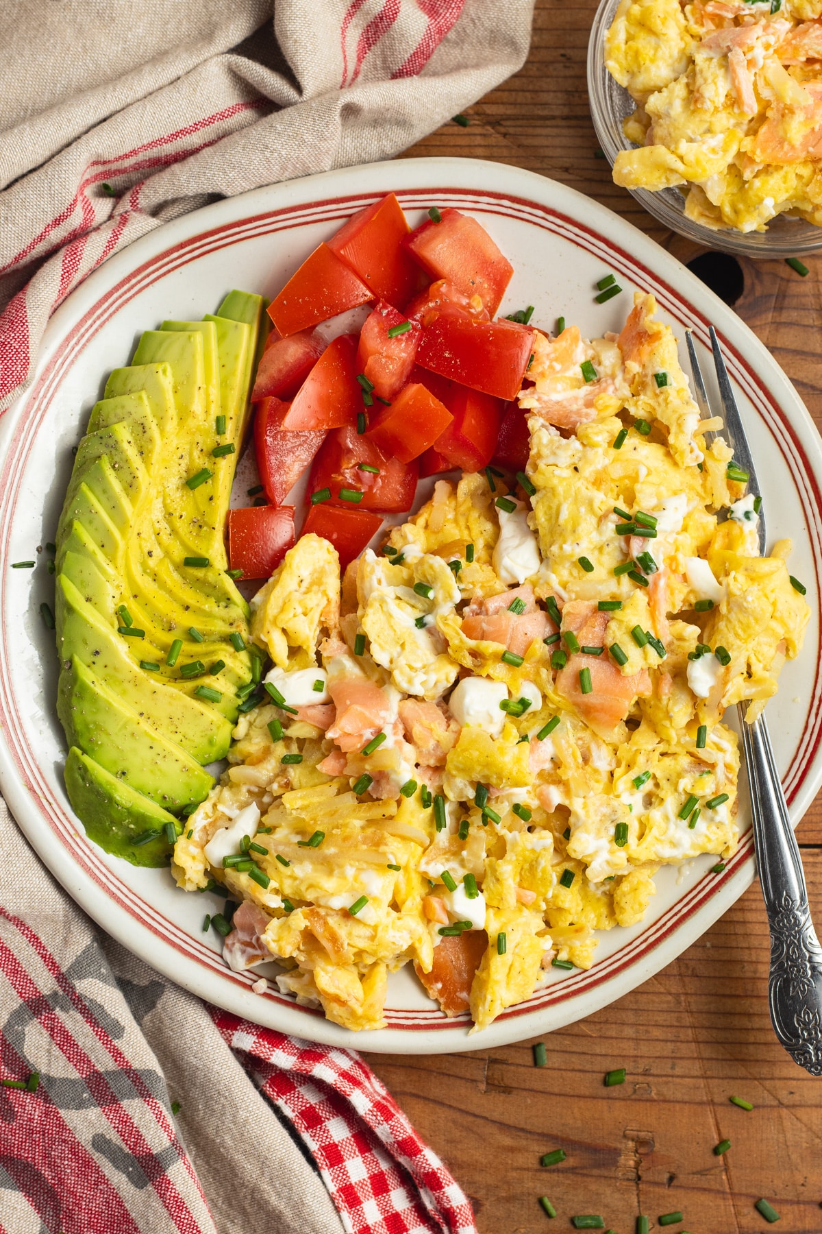 This is a picture of a plate with smoked salmon breakfast scramble.