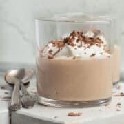 This is a square picture of a cup of cottage cheese chocolate mousse.