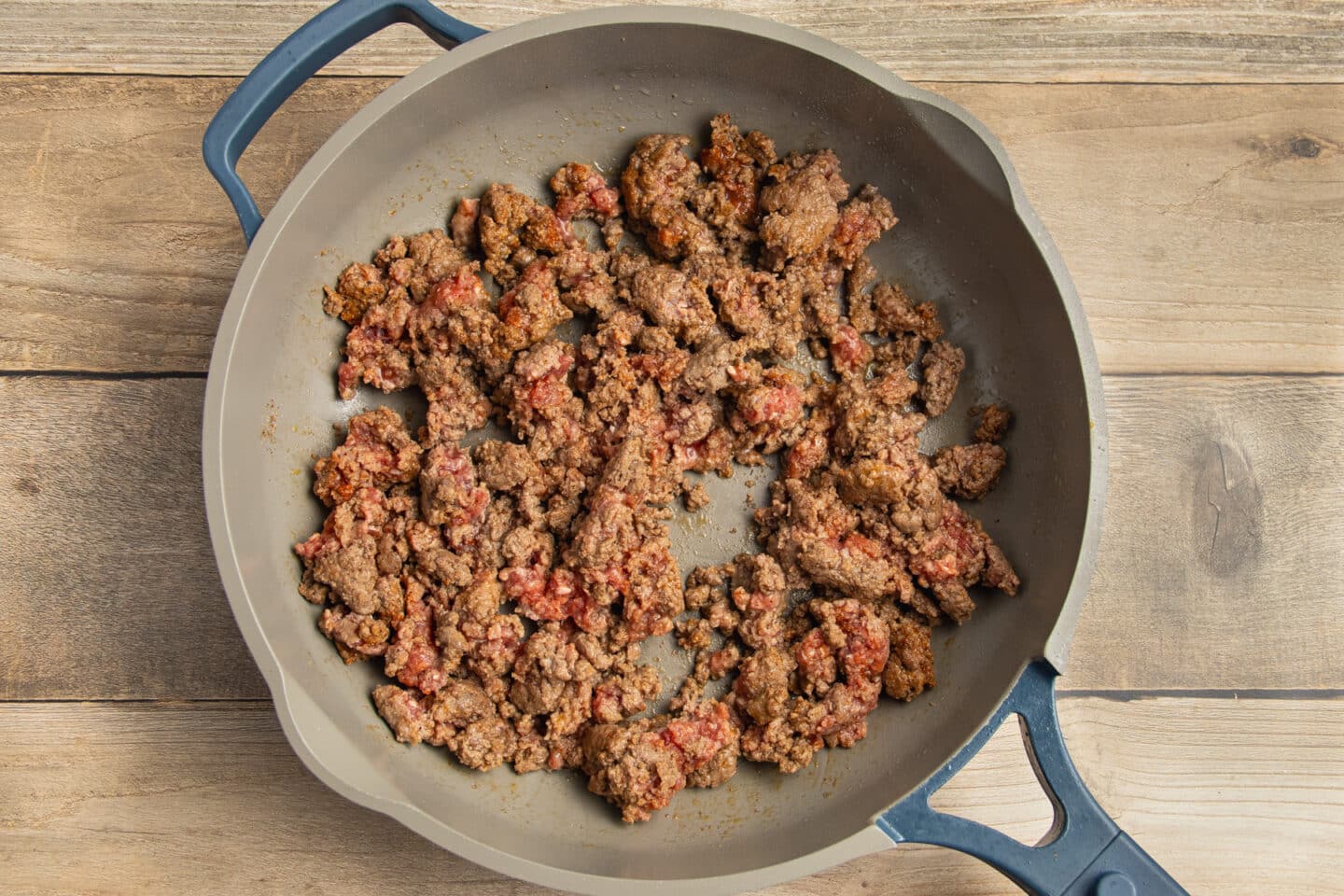 This is a picture of ground beef cooking in a skillet.