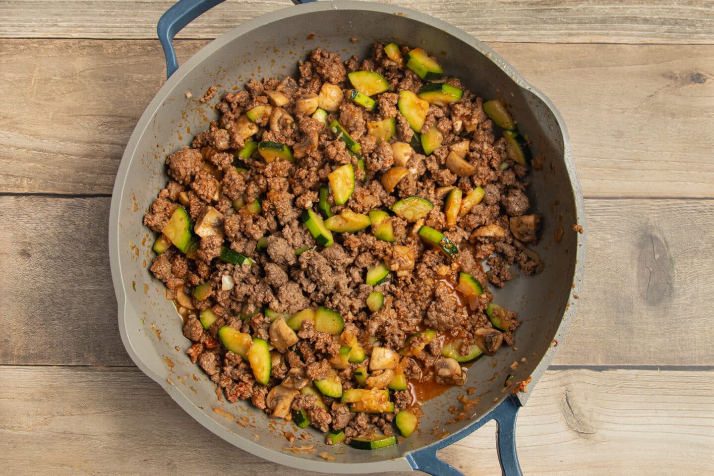 This is a picture of the food with added broth cooking in a skillet.