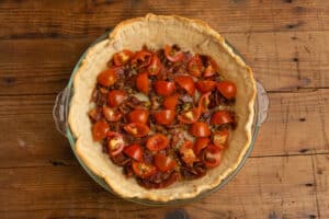 This is a picture of the crust with tomatoes added.