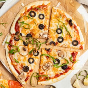 This is a square picture of an air fryer tortilla pizza.