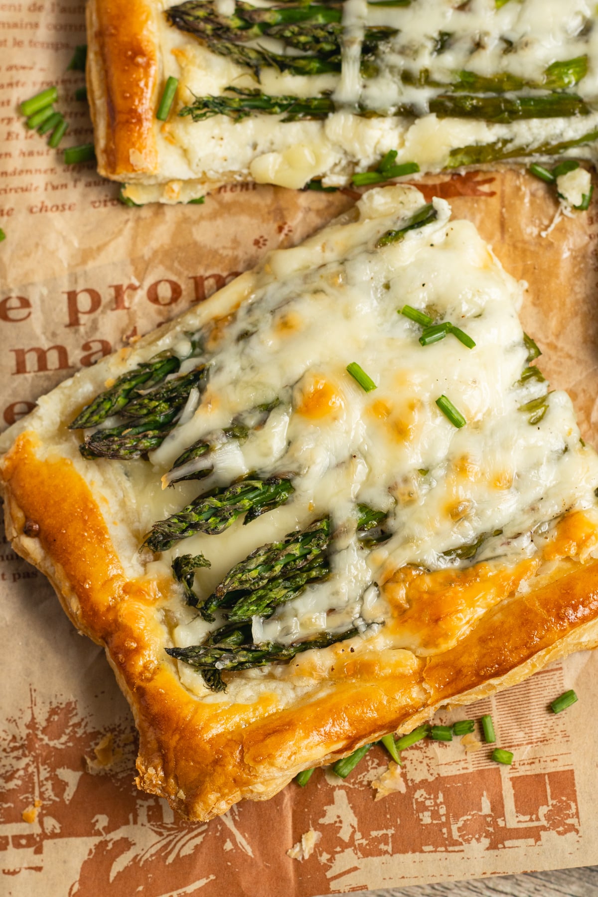 This is a picture of a slice of the asparagus puff pastry tart.