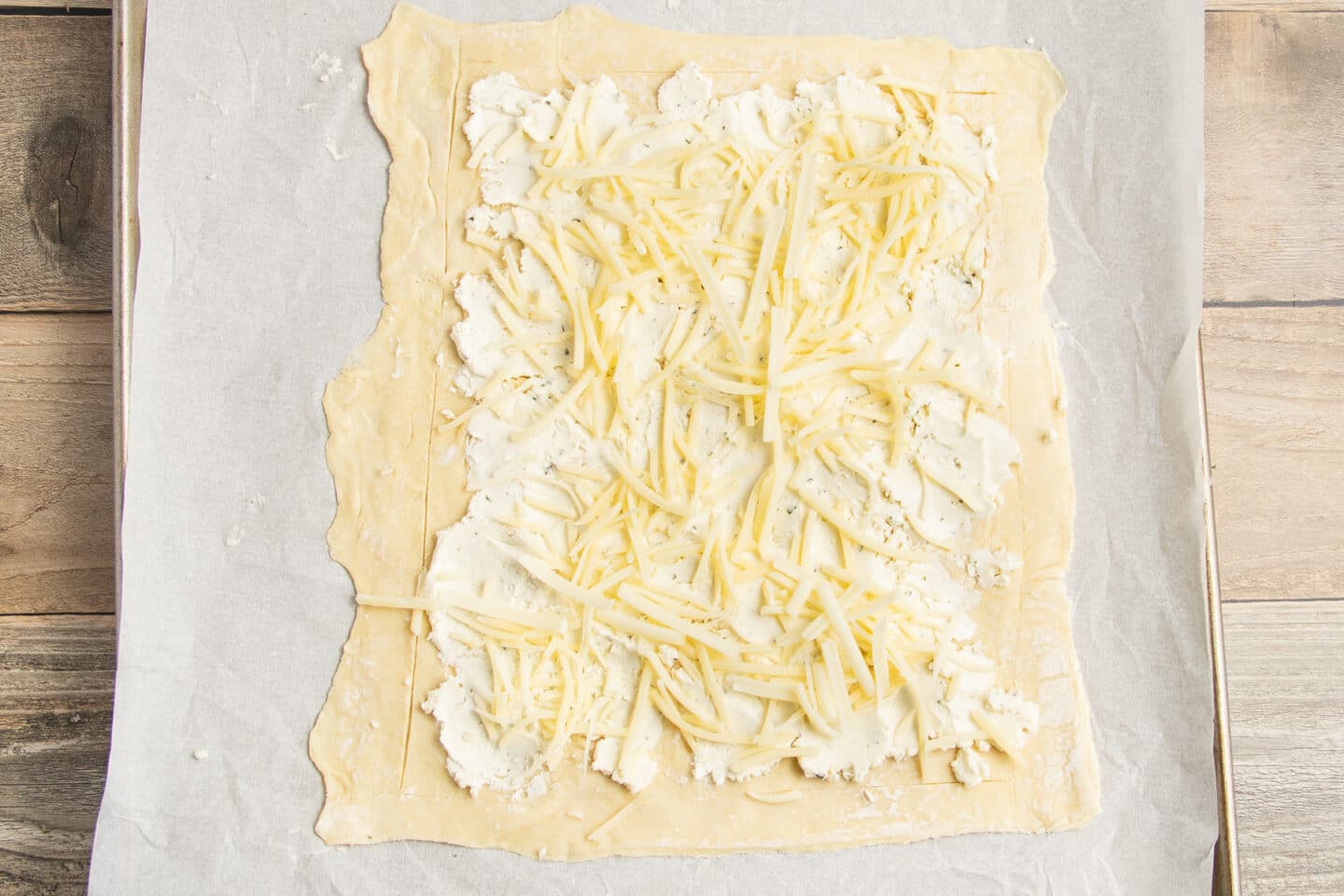 This is a picture of the puff pastry with Boursin and shredded cheese added.