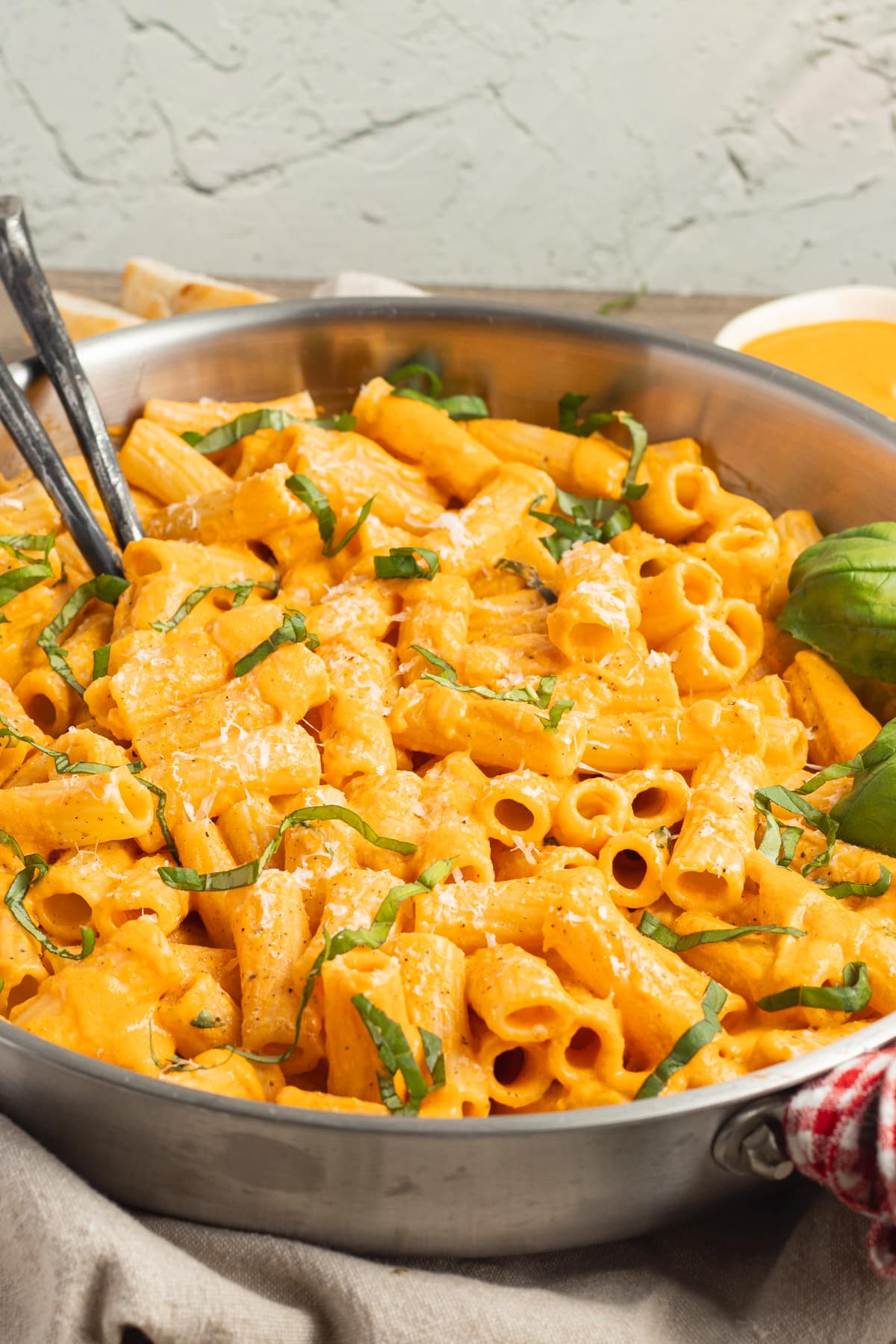 This is a picture of a skillet of pasta with cottage cheese tomato sauce.