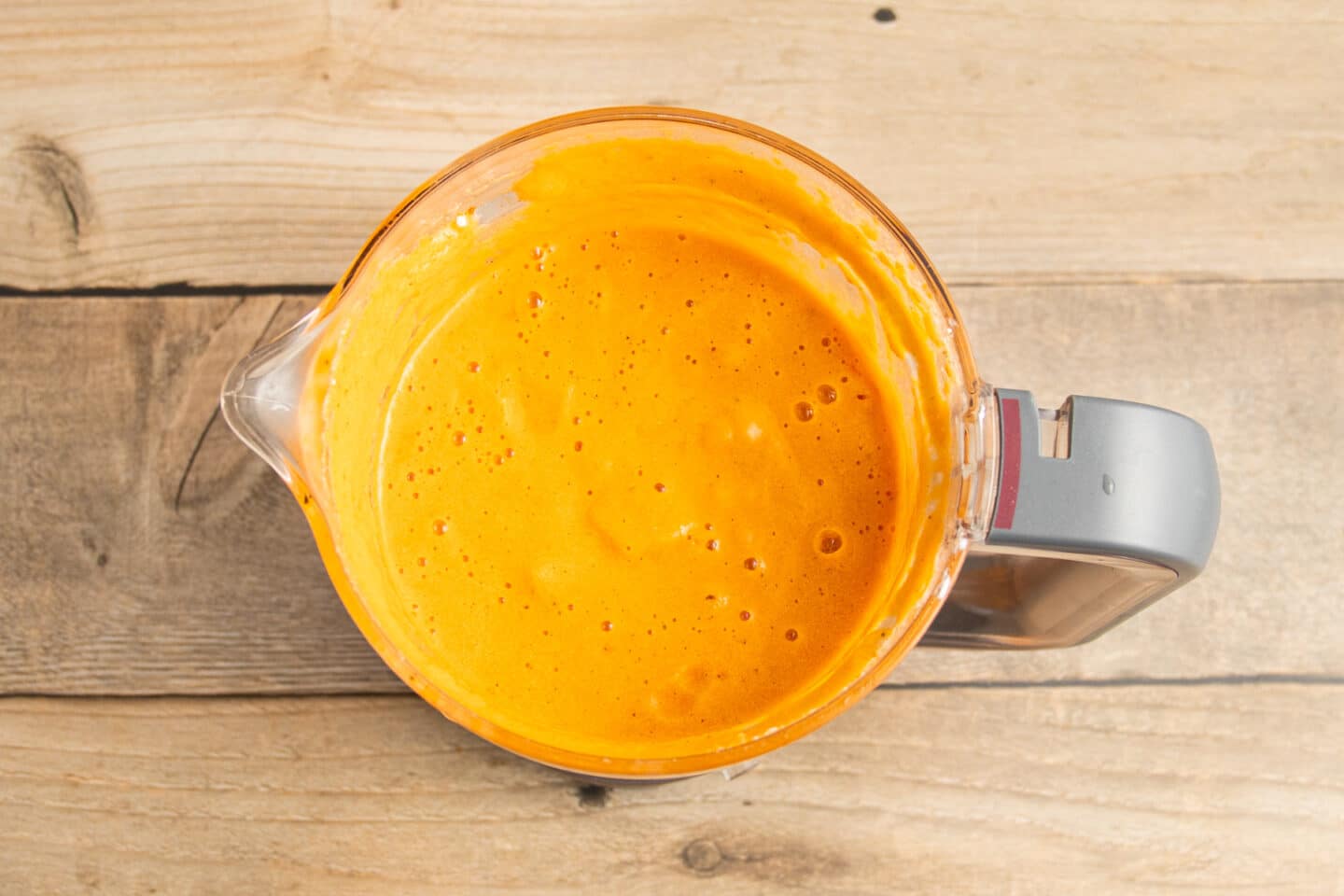 This is a picture of a blender with the tomatoes and cottage cheese after blending.