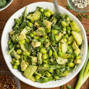 This is a picture of a bowl of edamame cucumber salad.