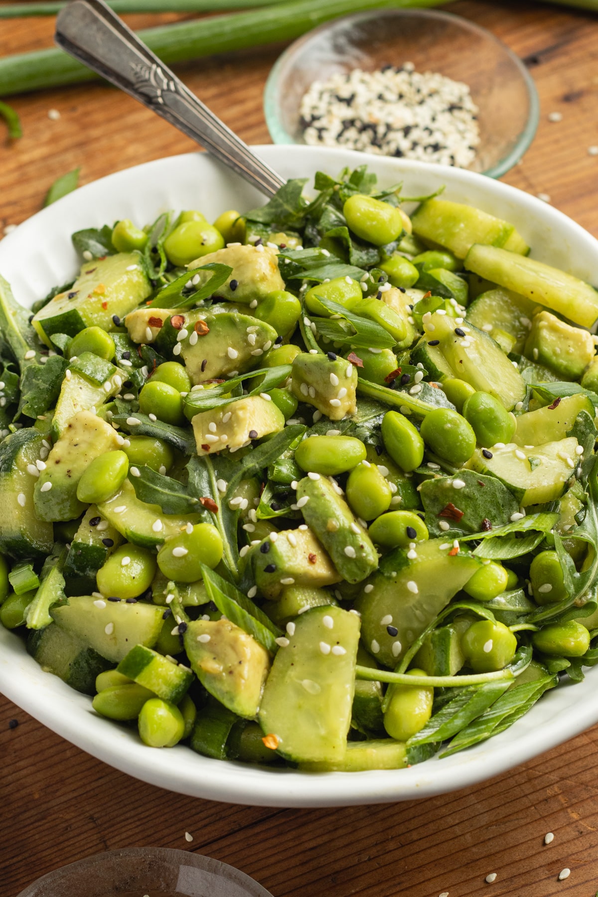 This is a picture of a bowl of edamame cucumber salad.