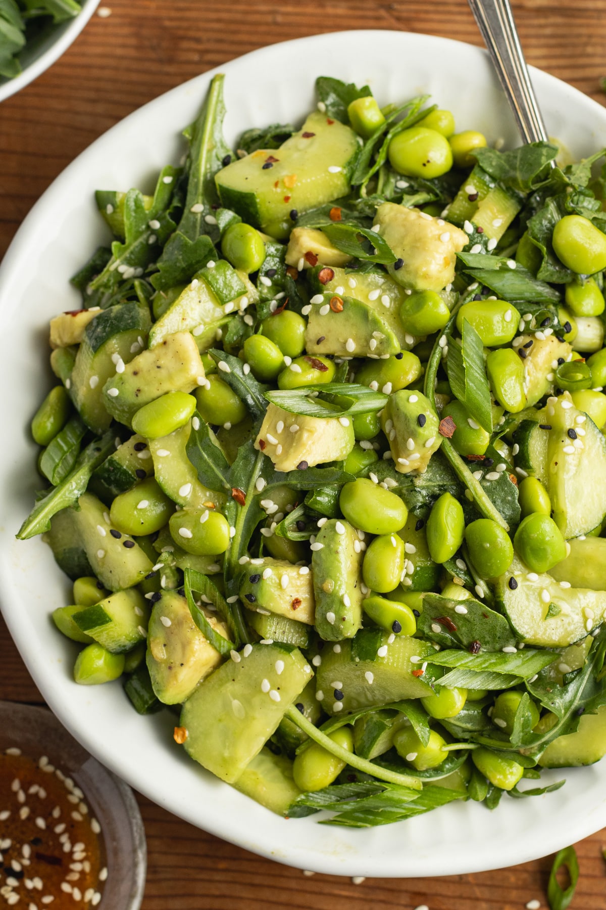 This is a picture of a bowl of edamame cucumber salad.