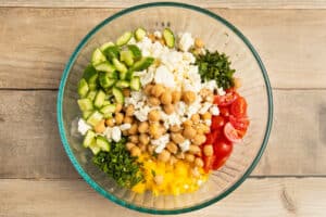 This is a picture of s a bowl of chickpea feta cucumber salad.