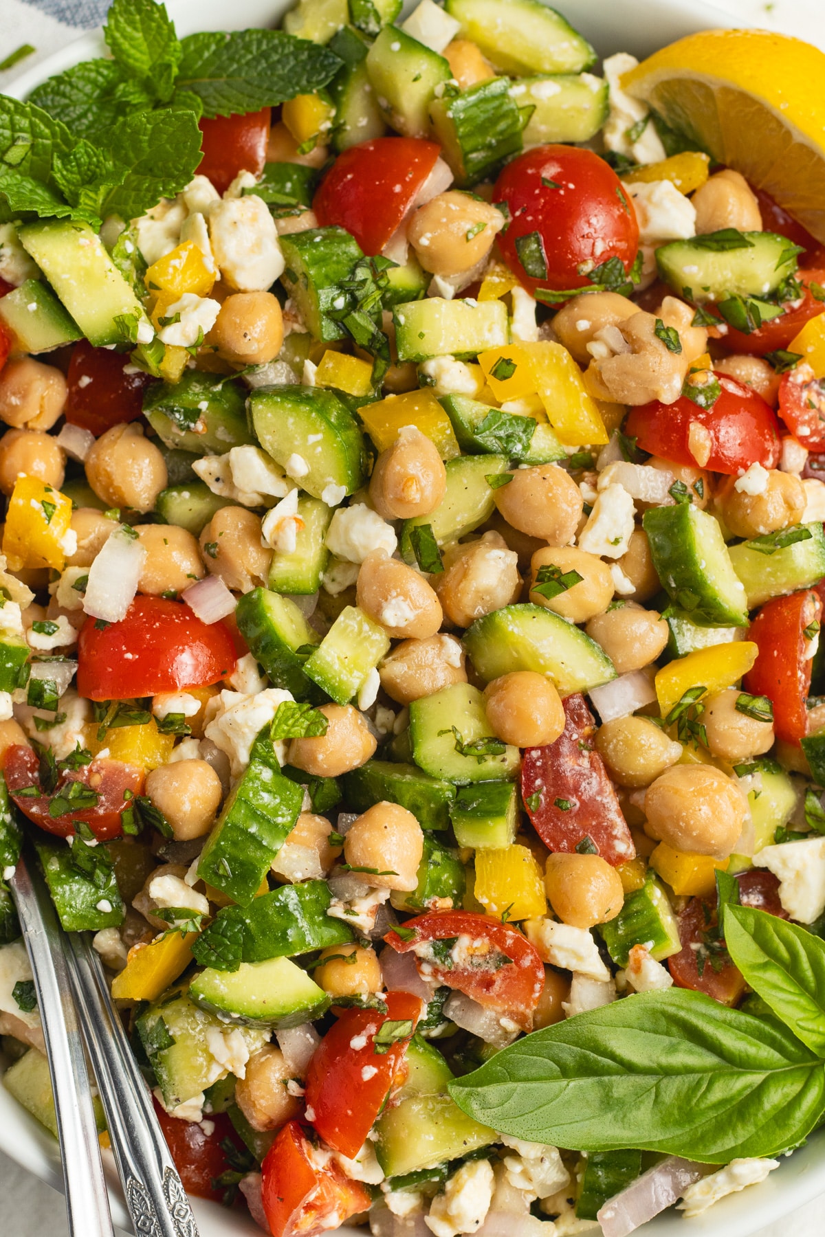 This is a picture of s a bowl of chickpea feta cucumber salad.