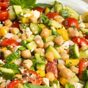 This is a picture of s a bowl of chickpea feta cucumber salad.
