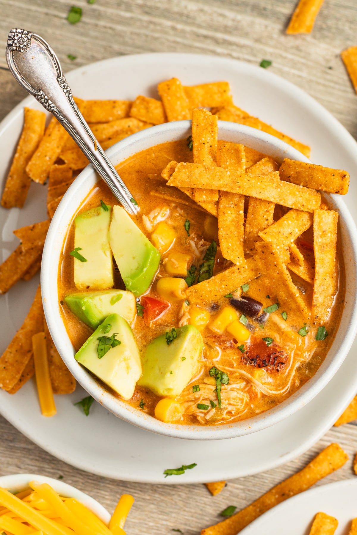 This is a picture of a bowl of creamy chicken tortilla soup.