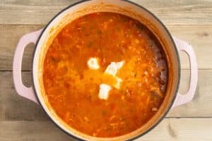 This is a picture of a pot with half and half and cream cheese added.