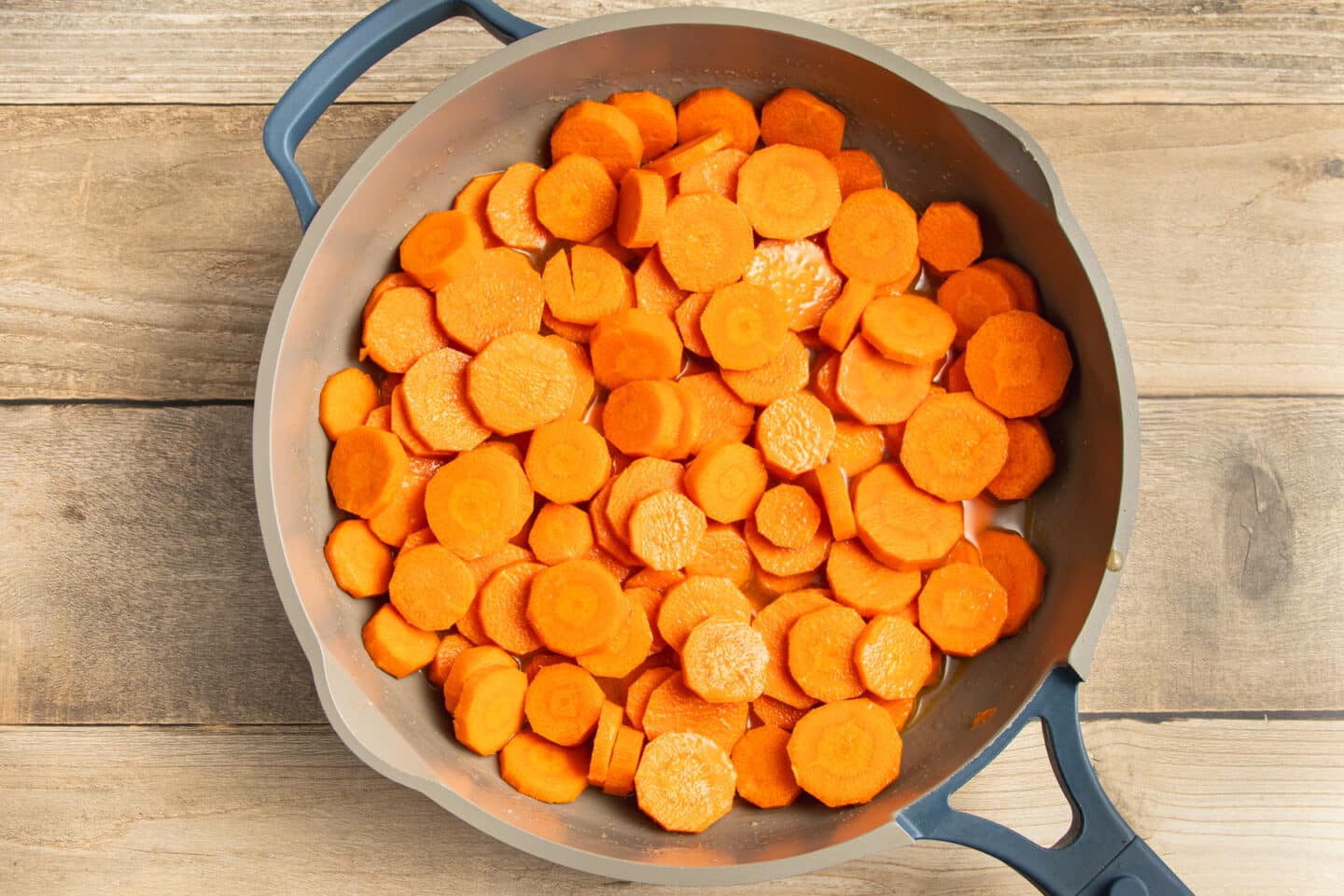 This is a picture of a skillet with the vichy carrots cooking.
