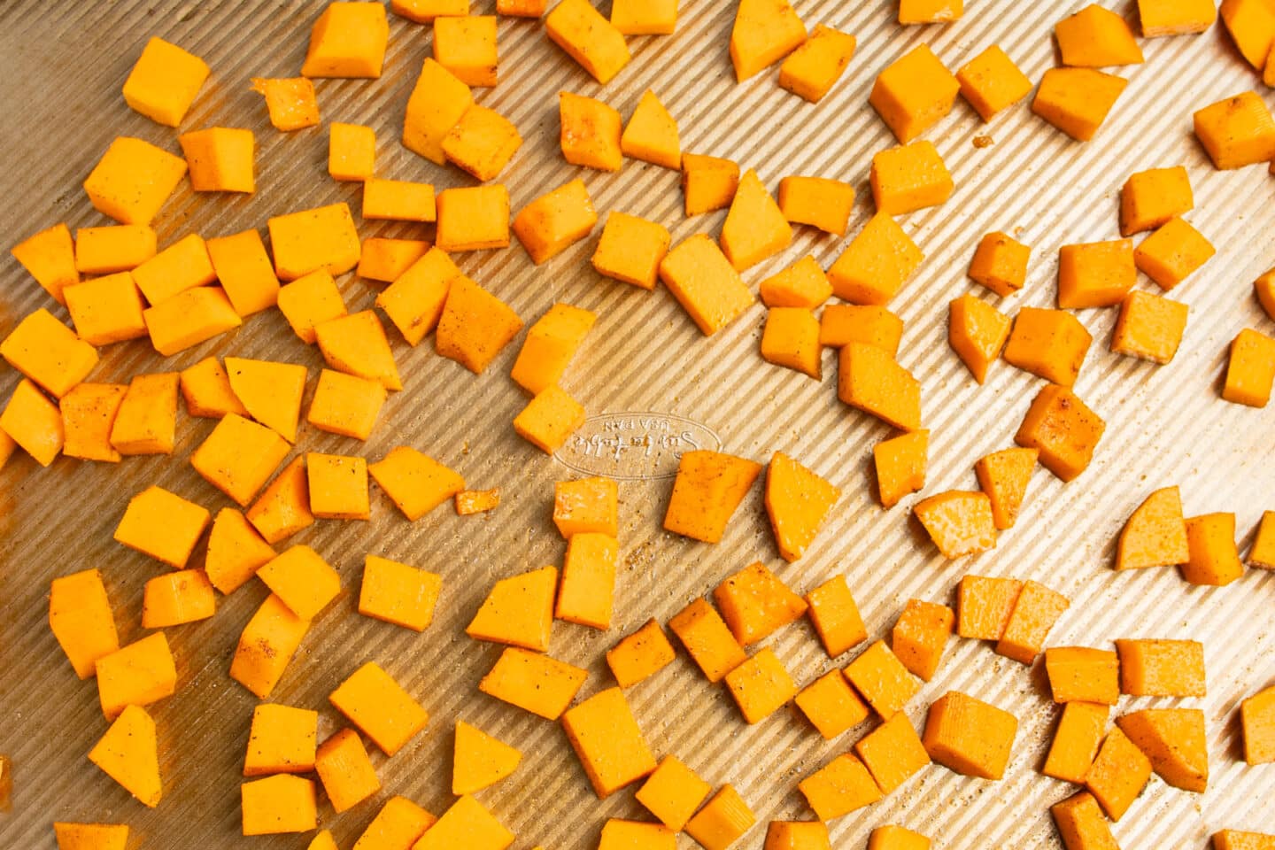This is a picture of butternut squash ready to get roasted.
