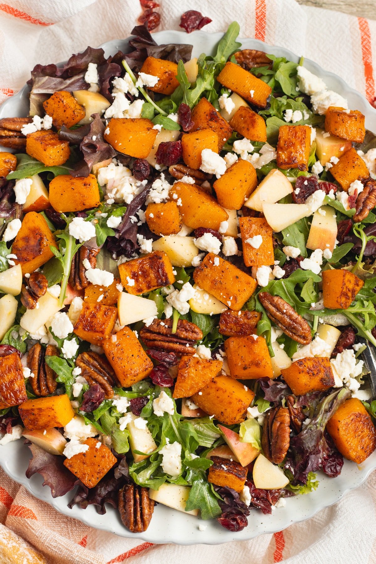 This is a picture of a plate of butternut squash feta salad.