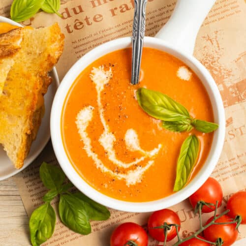 This is a picture of a bowl of roasted garlic tomato soup.