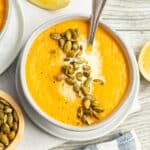 This is a picture of a bowl of carrot and cauliflower soup.