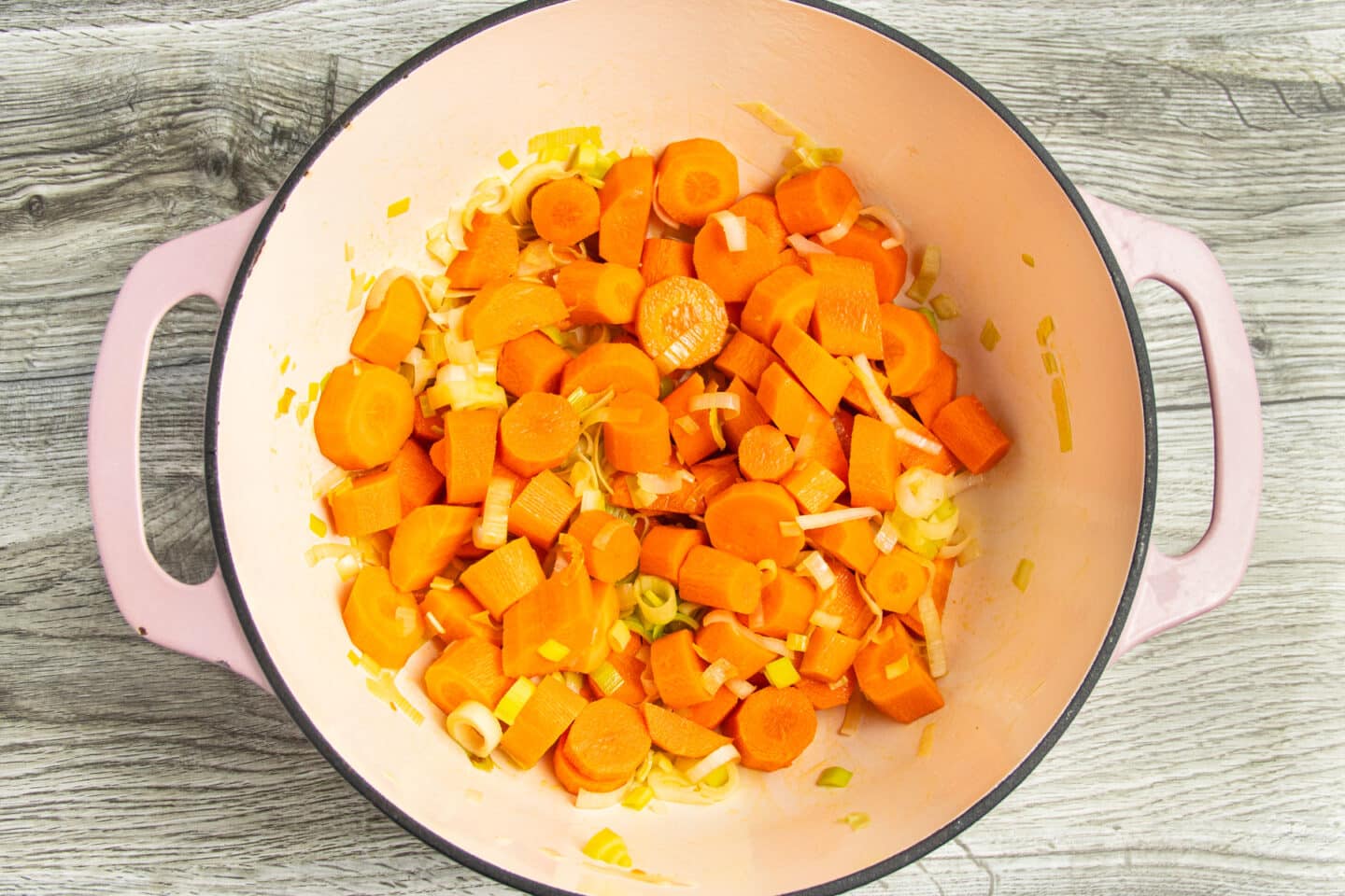 This is a picture of the leeks and carrots cooking in a Dutch oven.