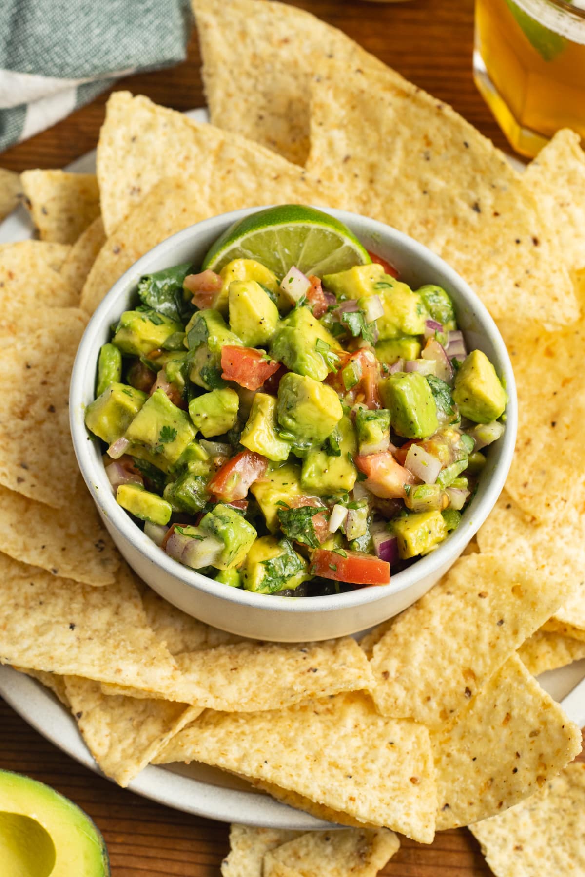 This is a picture of a bowl of avocado pico de gallo salsa.