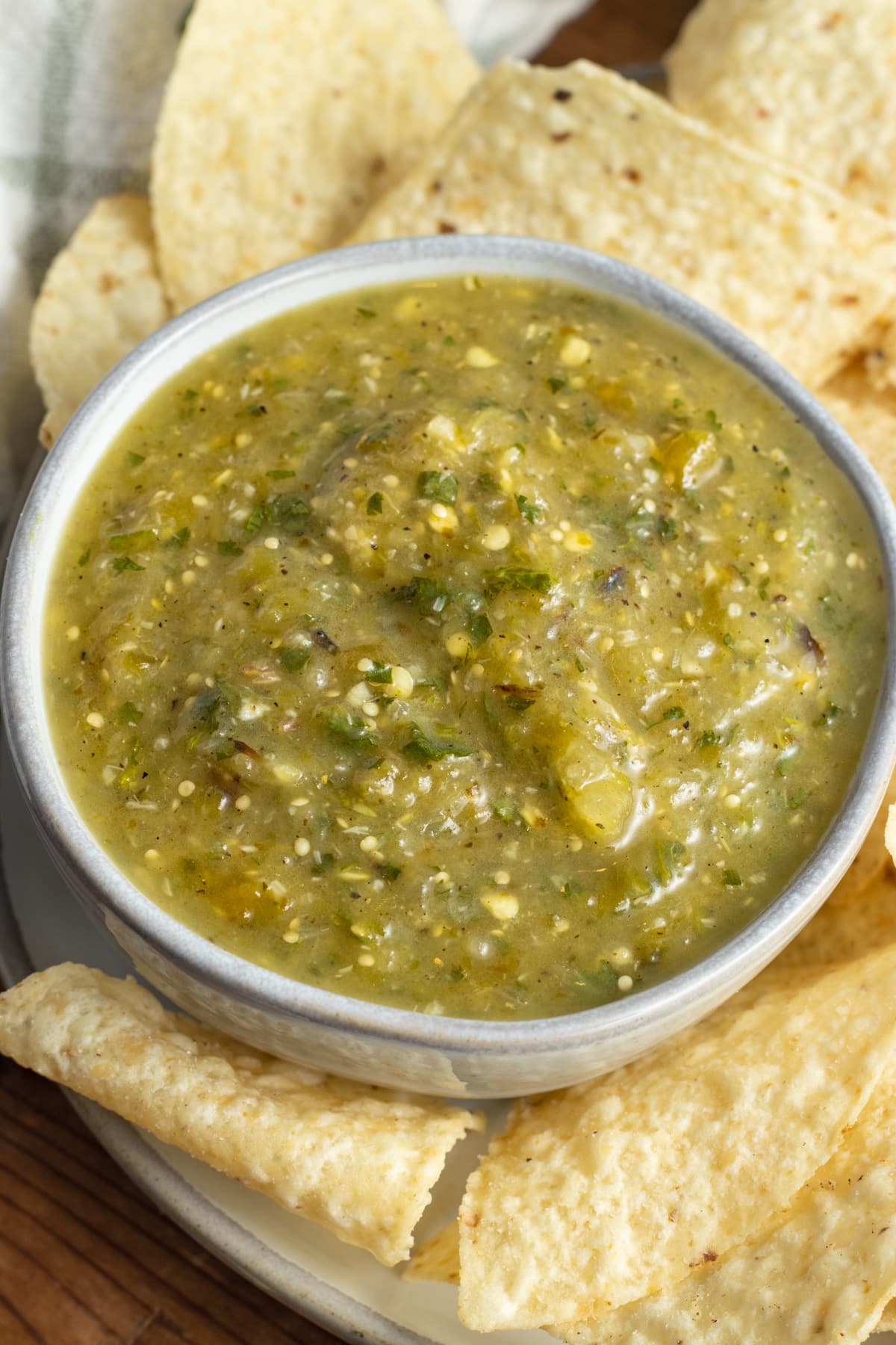 This is a picture of a bowl of roasted tomatillo salsa.