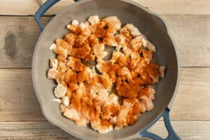This is a picture of the chicken being cooked in a skillet.