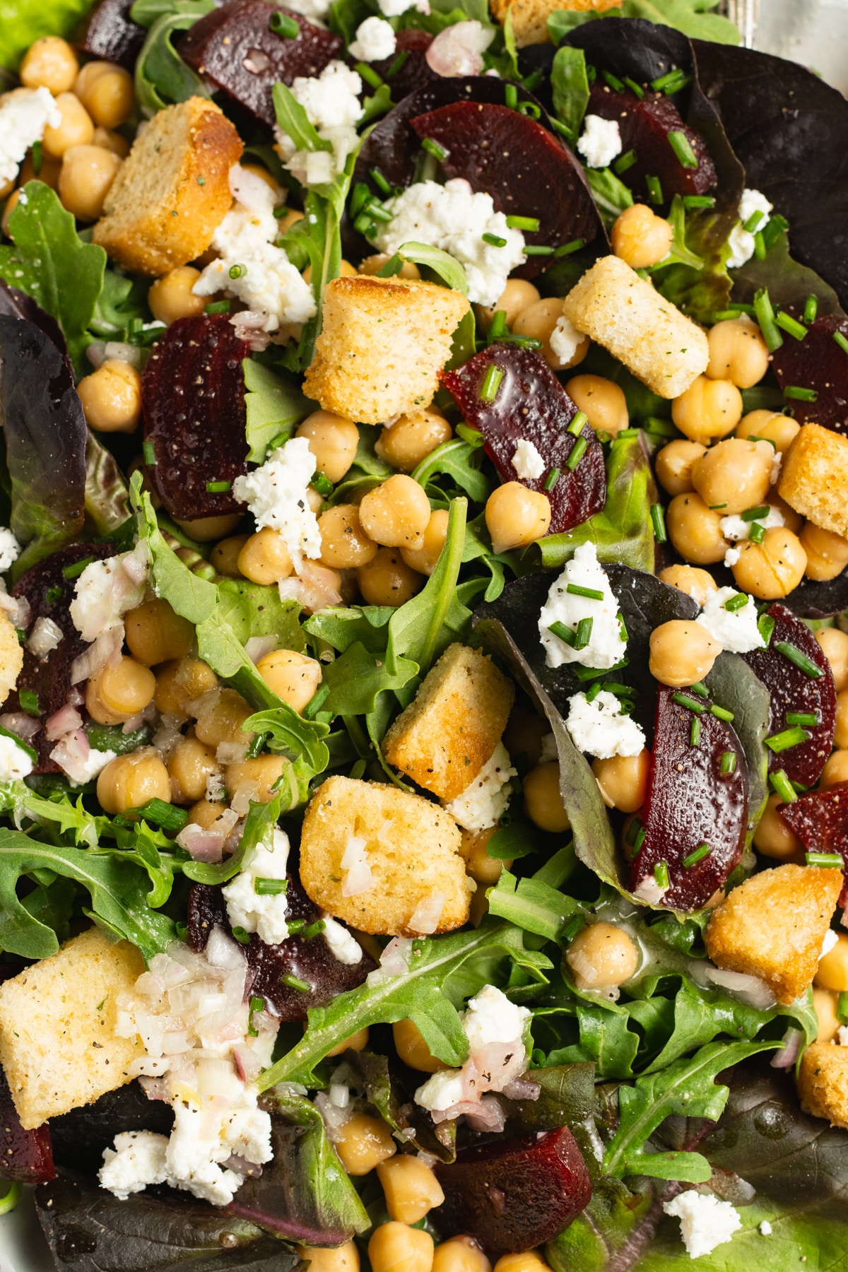 This is a picture of a plate of beet chickpea salad.