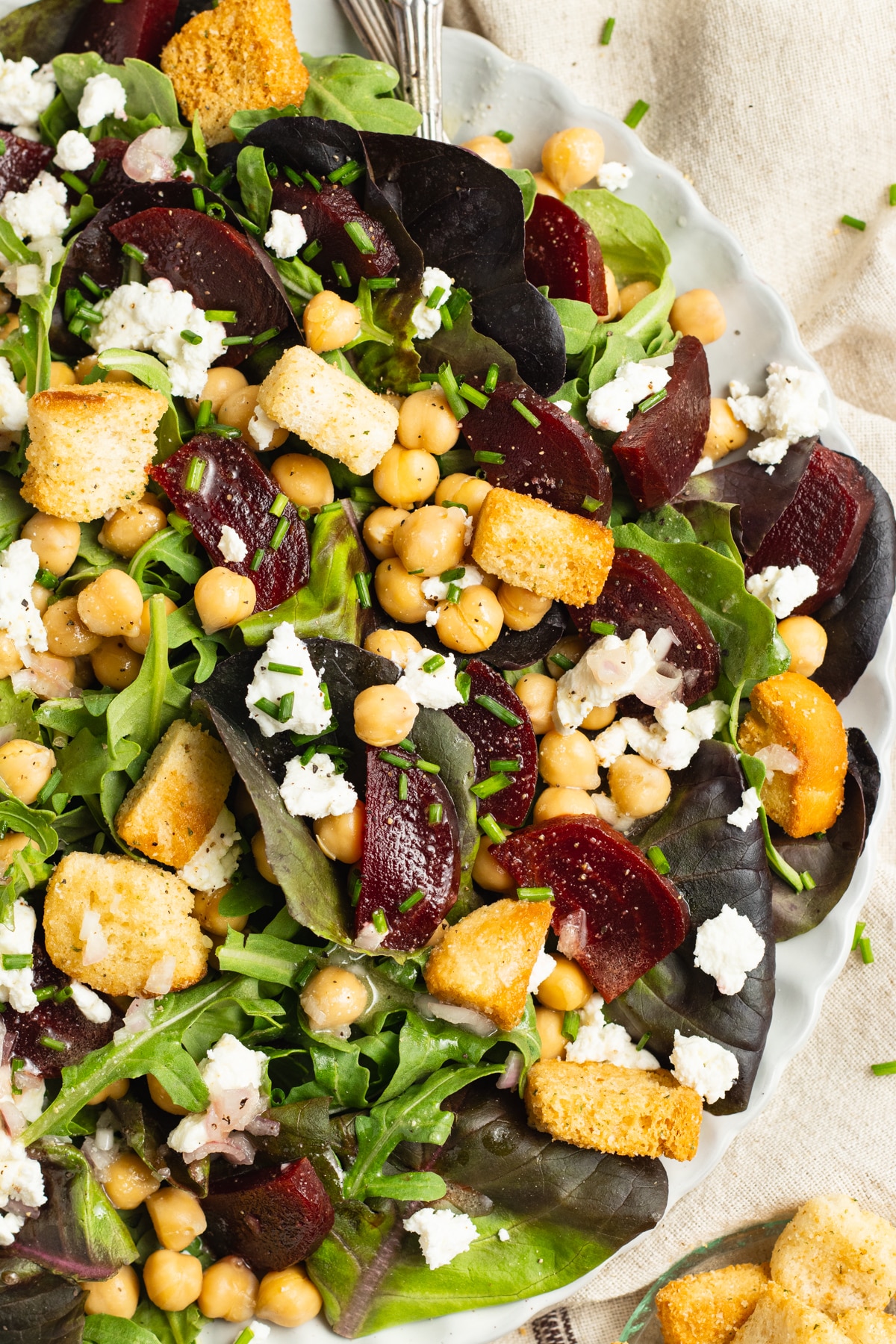 This is a picture of a plate of beet chickpea salad.