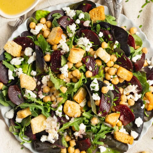This is a picture of a plate of beet chickpea salad.