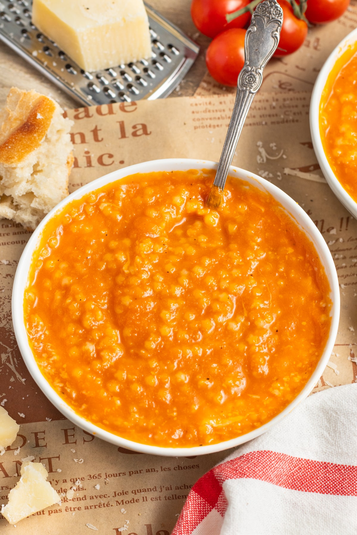 This is a picture of a bowl of tomato pastina soup.