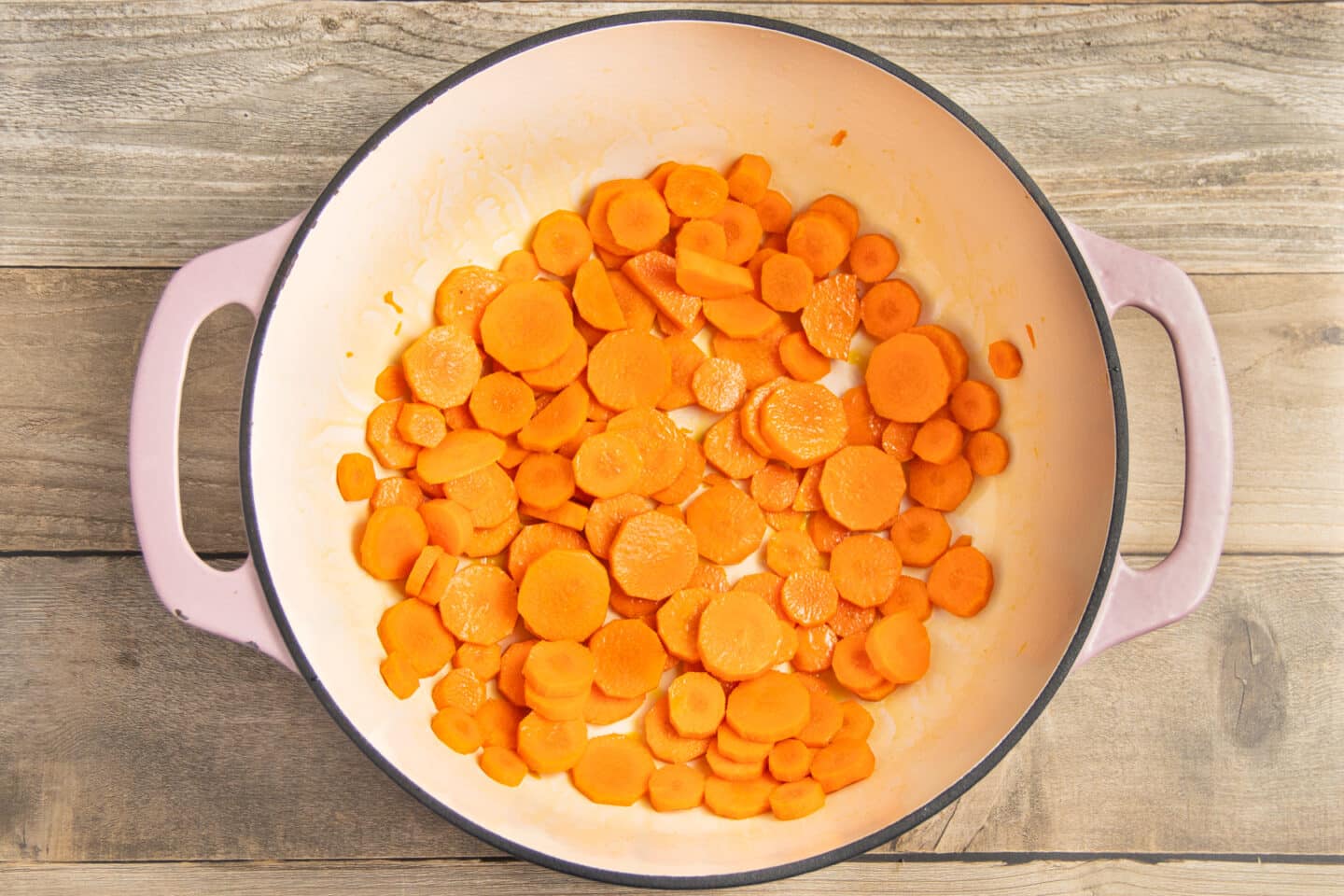 This is a picture of a pot with carrots cooking.