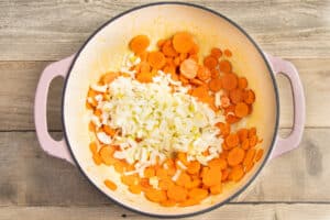 This is a picture of a pot with carrots and leeks added.